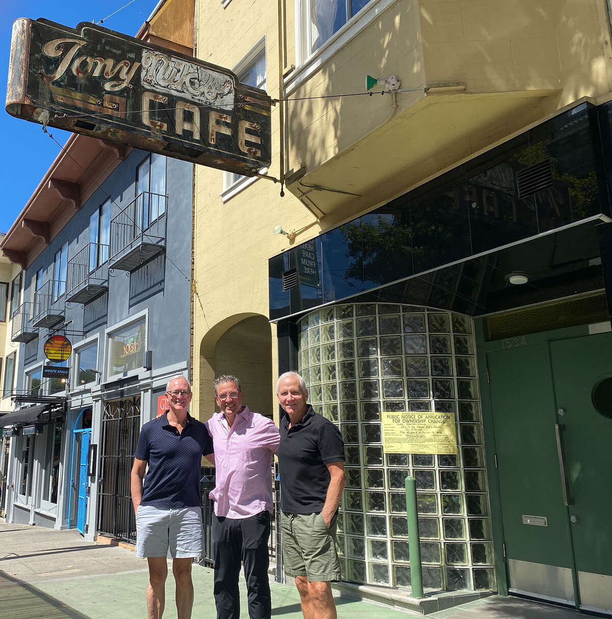 Former owners Dan Kent (left) and Mark Nicco (right) recently sold Tony Nik's bar to longtime client Sebastian Scala (centre).