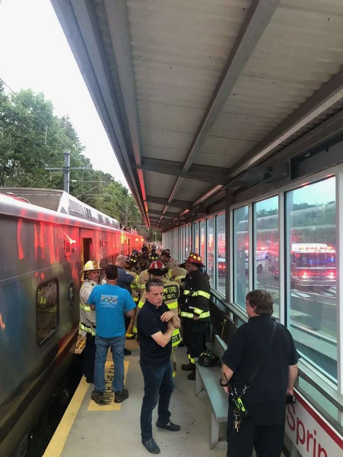 First responders rescued a woman who fell between the train and platform at the Springdale train station on Hope Street Tuesday night.