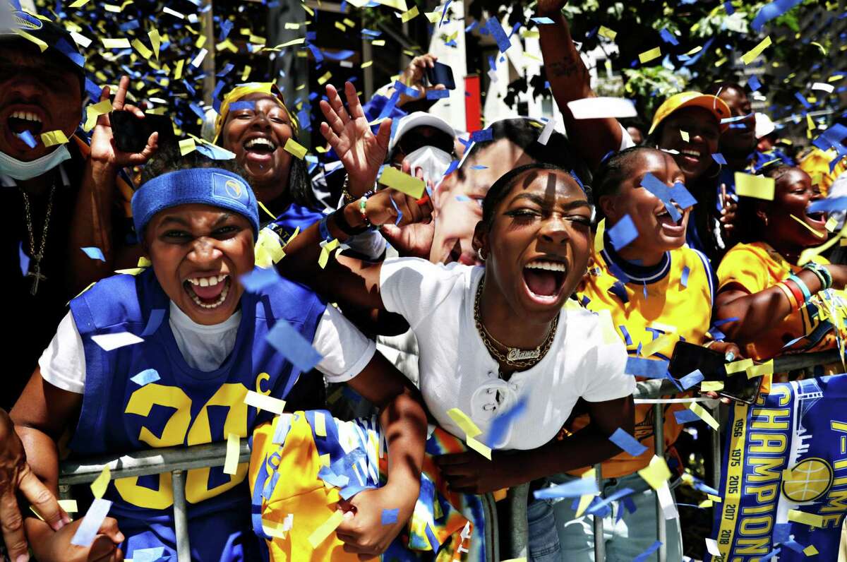 Fans cheer during the Warriors Championship parade in San Francisco in June.