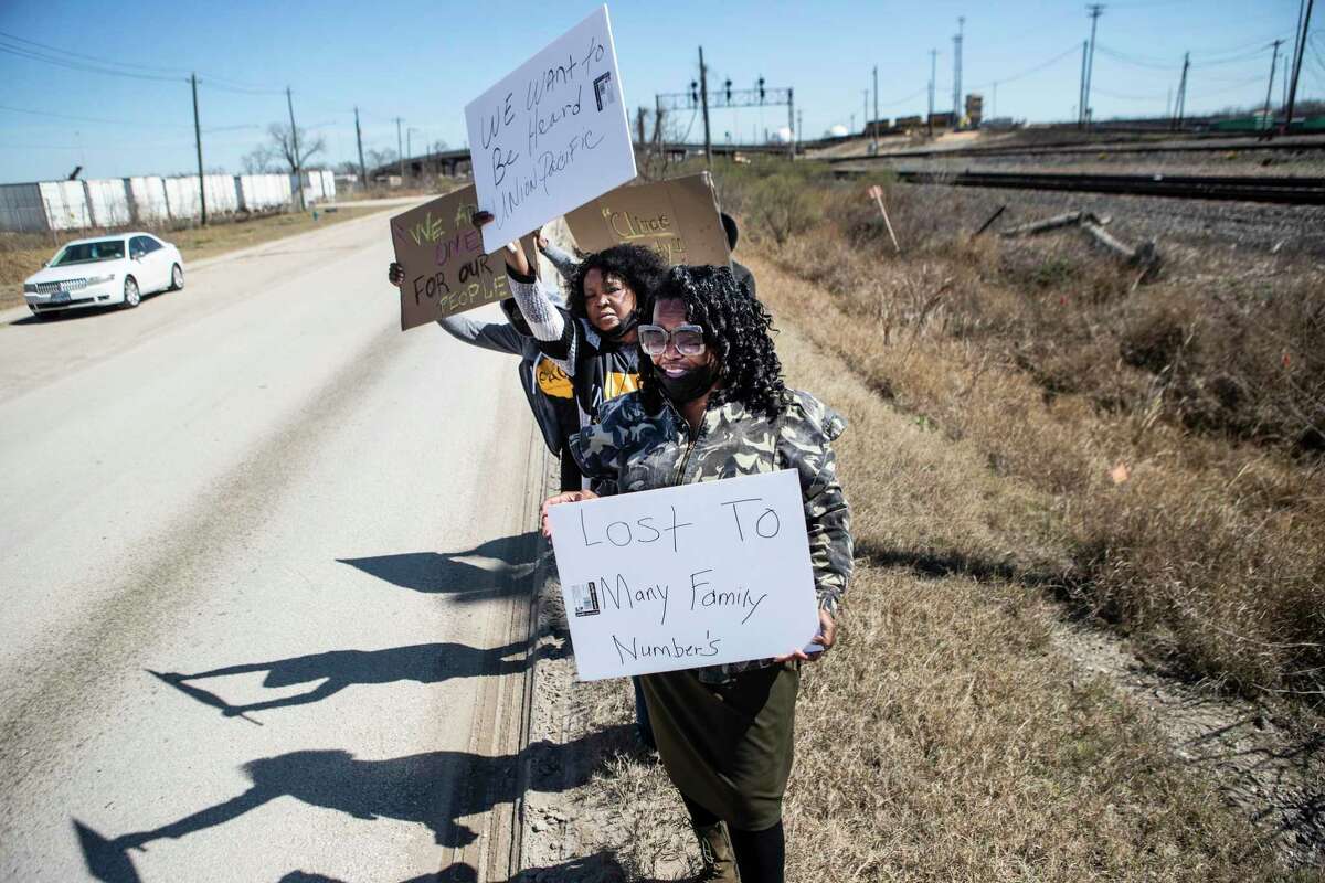 Delores Peterson, front, and Dianne Sutton Osborne join a group of Fifth Ward residents protesting environmental pollution by Union Pacific outside a rail yard along Liberty Road Monday, Feb. 28, 2022 in Houston.
