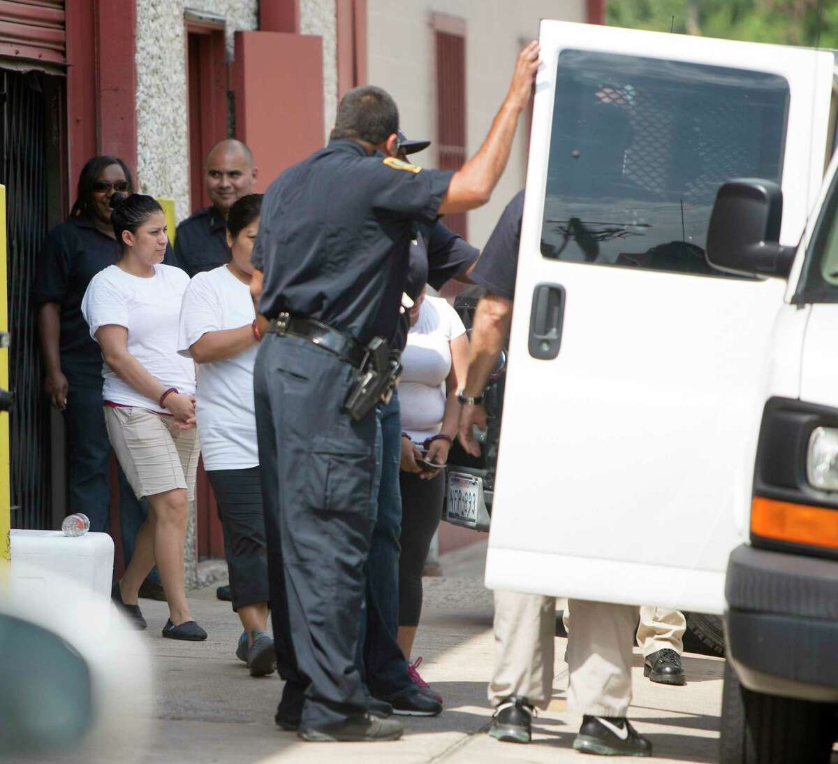 Federal agents raid a tortilla factory in the Heights, Tuesday, Aug. 4, 2015, in Houston. The raid began about 10 a.m. at La Espiga de Oro at 1200 15th Street near Shepherd. Eleven workers from the factory were detained at the scene.