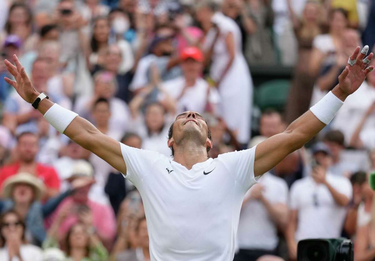 Rafael Nadal celebrates after beating American Taylor Fritz in a men’s singles quarterfinal match on Day 10 of the Wimbledon tennis championships in London.