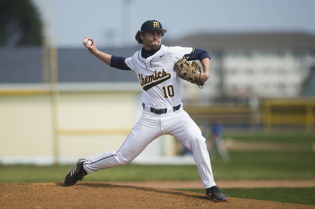 Midland High's Al Money delivers a pitch during an April 8, 2021 game against Traverse City West.