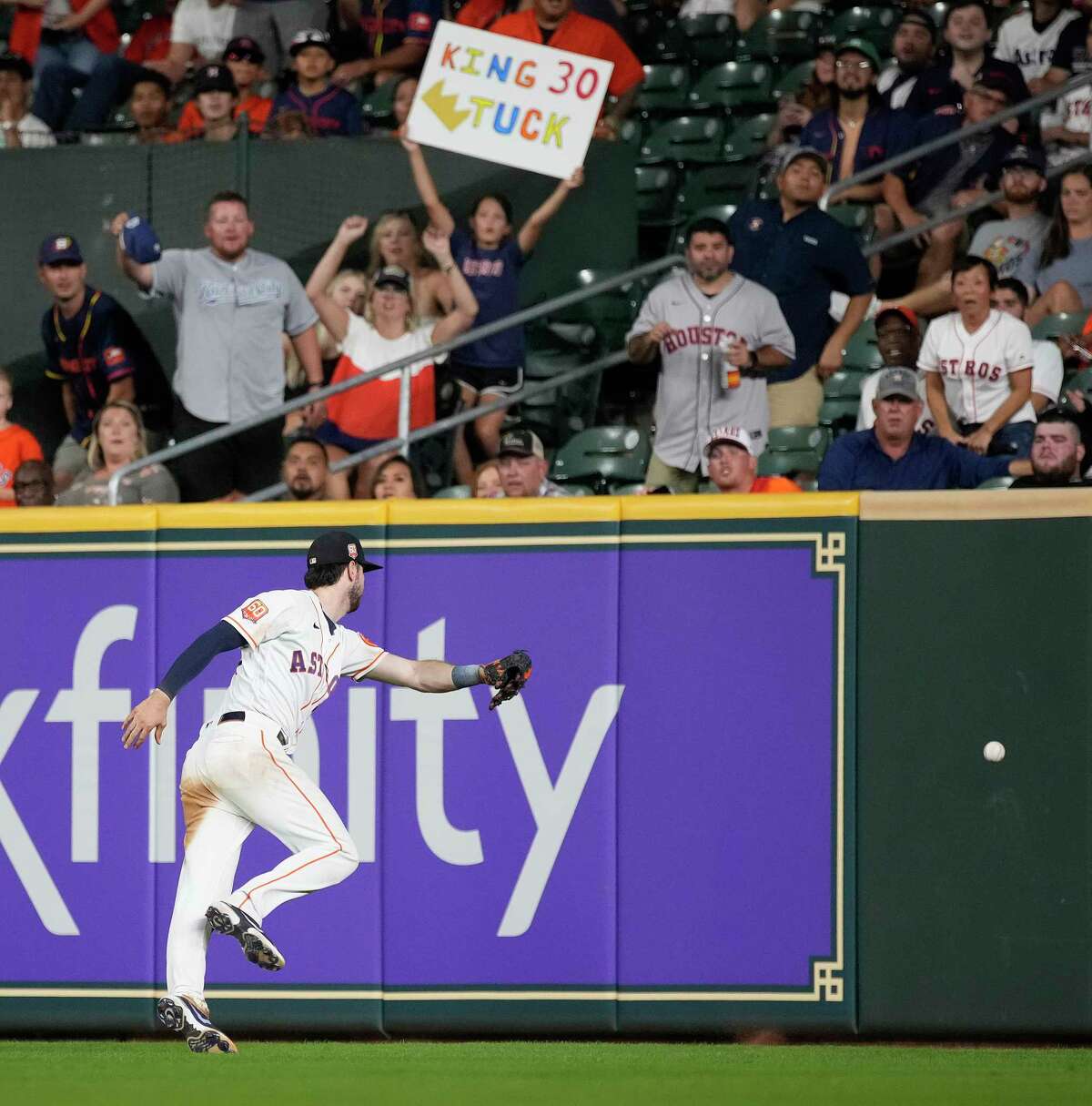 Houston Astros right fielder Kyle Tucker (30) tries to field Kansas City Royals Nicky Lopez’s ground-rule double during the ninth inning of a MLB game at Minute Maid Park on Wednesday, July 6, 2022 in Houston.