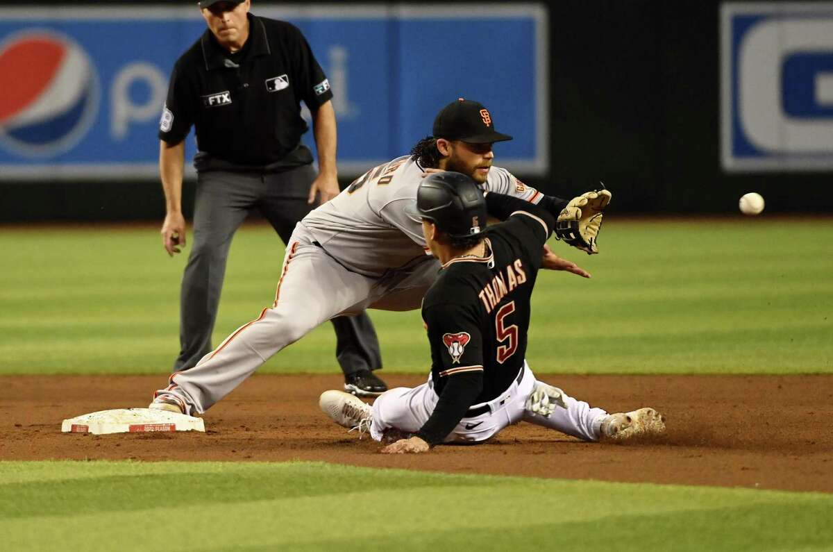 PHOENIX, ARIZONA - JULY 06: Brandon Crawford #35 the San Francisco Giants forces out Alek Thomas #5 of the Arizona Diamondbacks at second base in `the second inning at Chase Field on July 06, 2022 in Phoenix, Arizona. (Photo by Norm Hall/Getty Images)