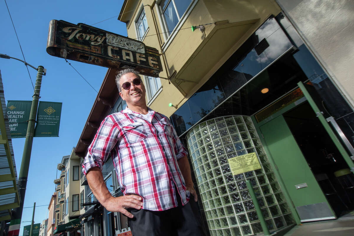 Sebastian Scala, poses for a photo outside Tony Niks in San Francisco, California on July 7, 2022. Scala, a longtime patron and manager, is the new owner of Tony Niks, an old-fashioned bar in heart of North Beach. He is committed to preserving his legacy.