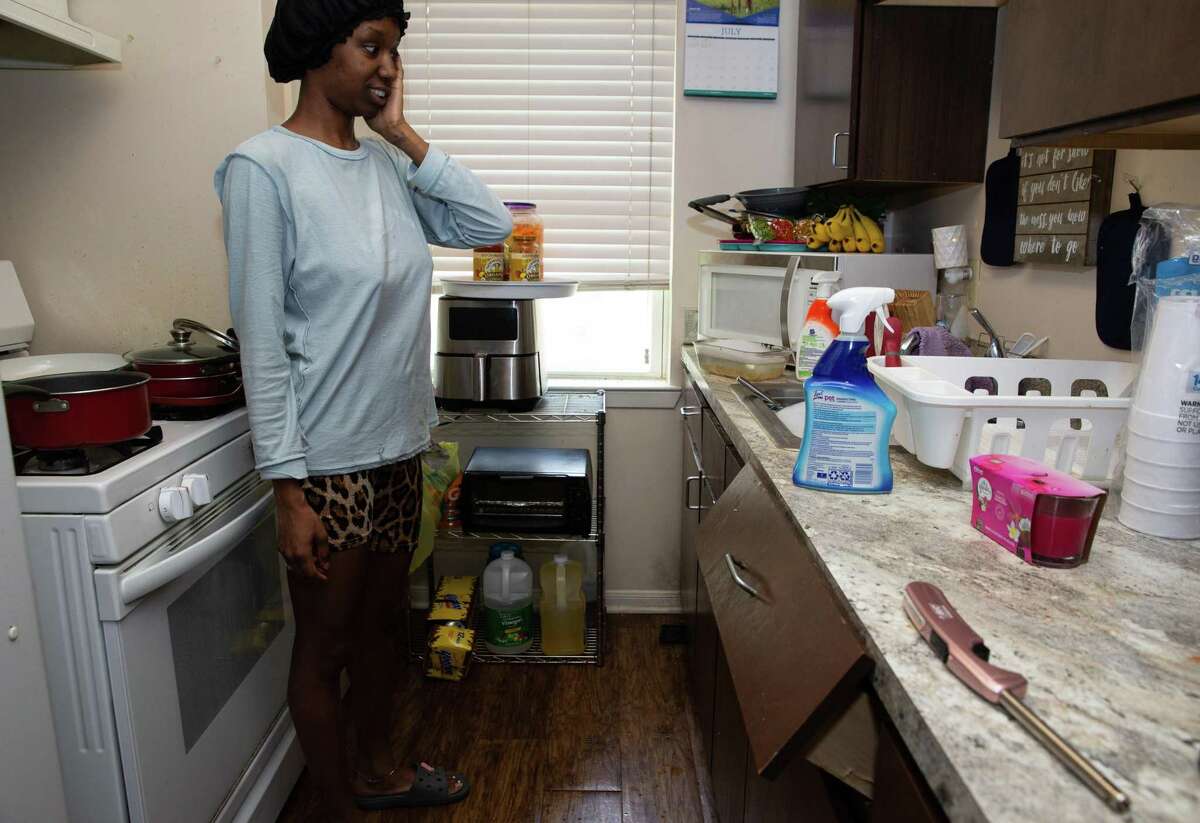 Cleme Manor Apartments resident Danielle Adams shows her apartment with pest issues Wednesday, July 6, 2022, in Houston. Besides pest issues, Adams said she had submitted work orders for the broken kitchen drawer.