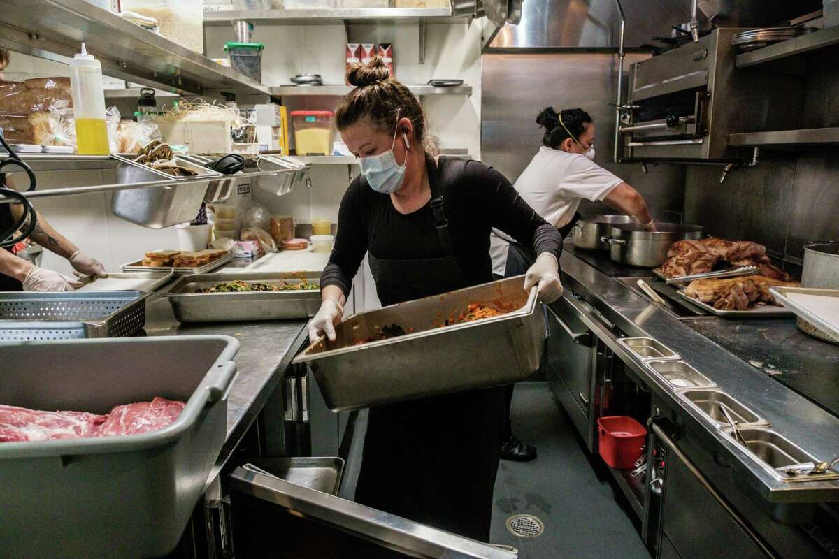 Chef and owner of Nightbird restaurant Kim Alter prepares meals at her restaurant in San Francisco, Calif. on Monday March 30, 2020. The meals will be delivered to low income housing units and SRO’s the following day.