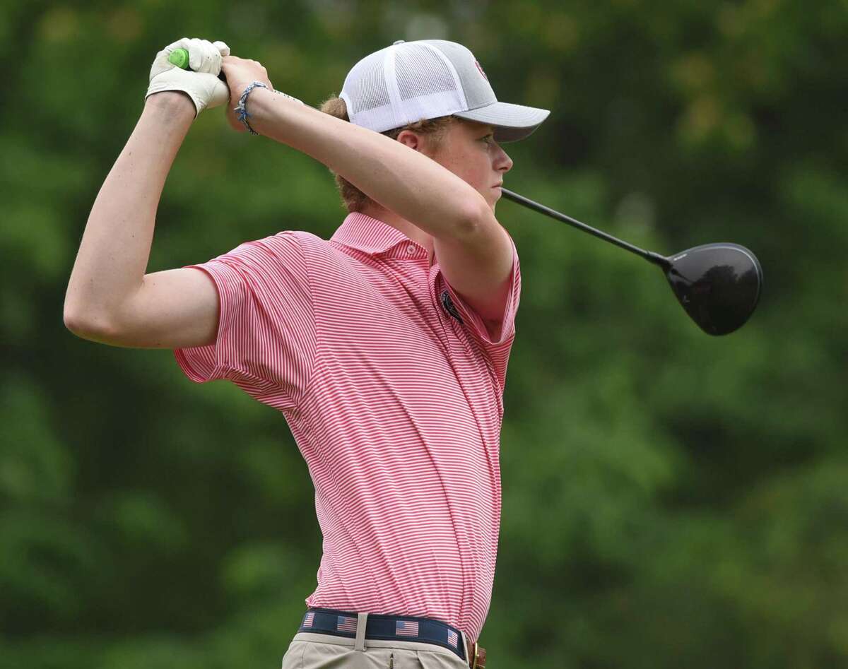 New Canaan's Cullen McCarthy watches his tee shot on the 10th hole during the FCIAC boys golf championship at Fairchild Wheeler Golf Course on June 3, 2021.