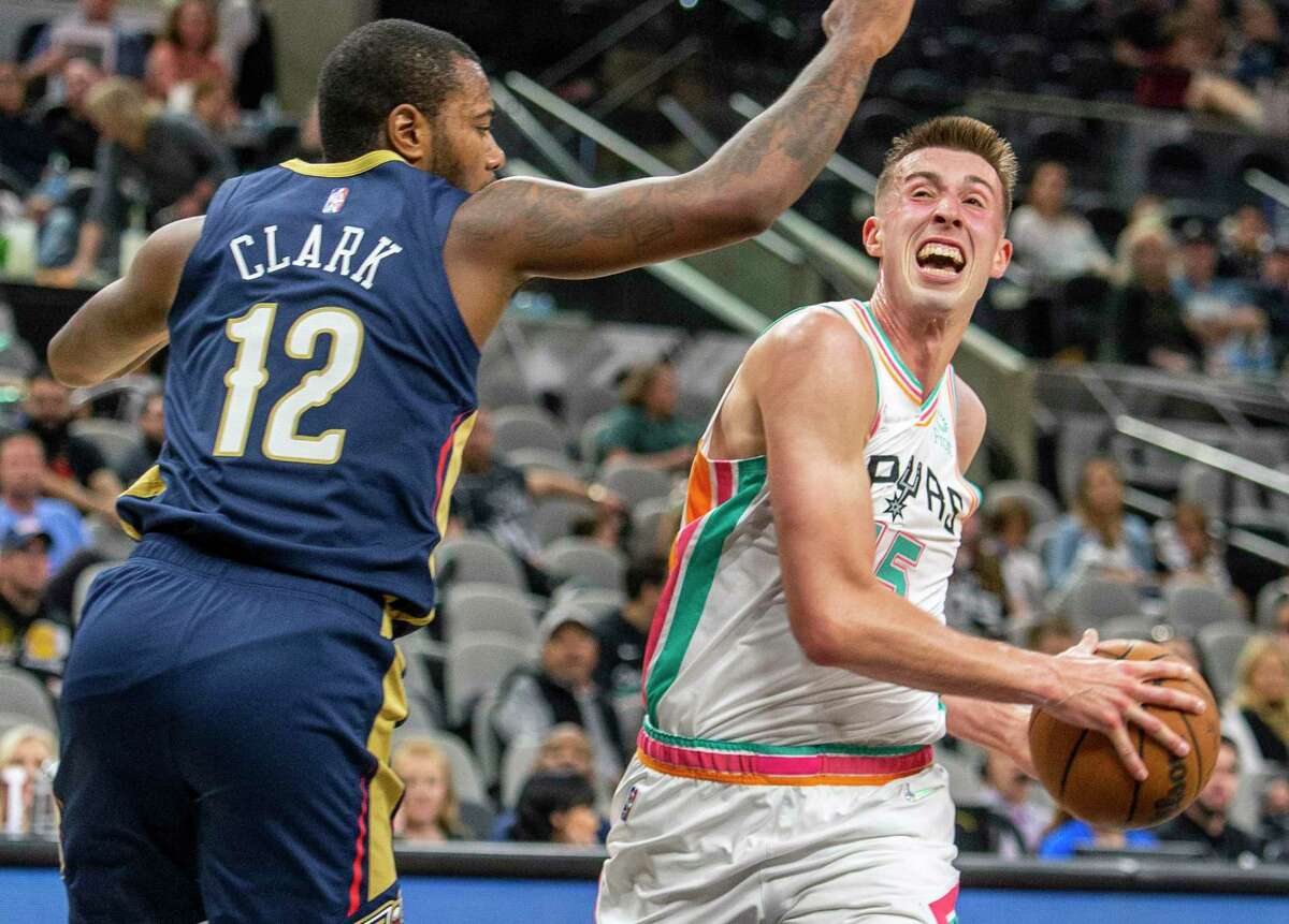 San Antonio Spurs forward Joe Wieskamp (15) struggles Friday night, March 18, 2022 to get around the Pelicans?• Gary Clark during the second half of the Spurs?• 124-91 loss to the Pelicans.