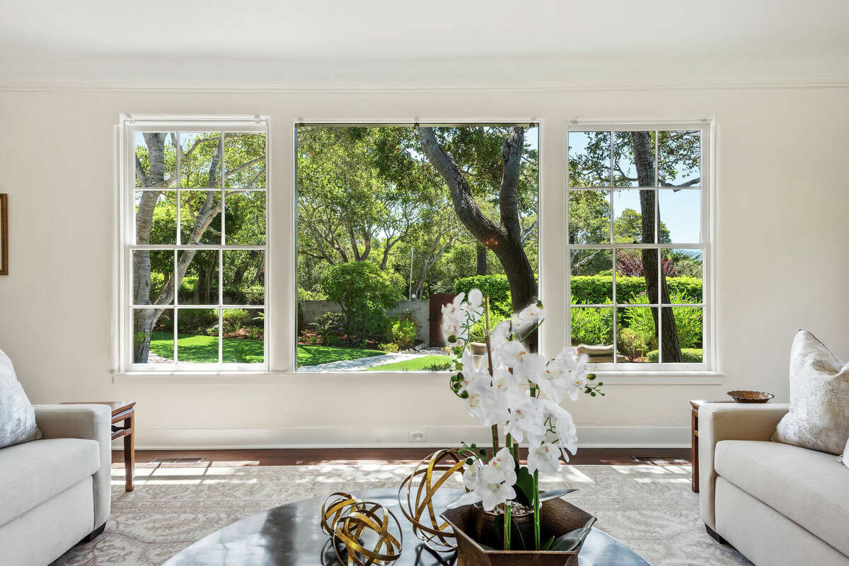 The living room has a window overlooking the front yard.
