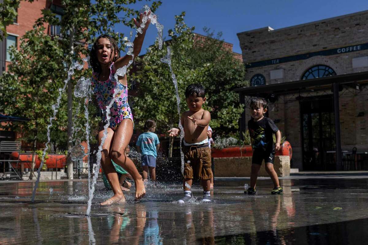 Lydia Aschbacher, 6, plays in the splash pad at the Pearl in San Antonio during triple-digit heat Thursday, July 7, 2022.