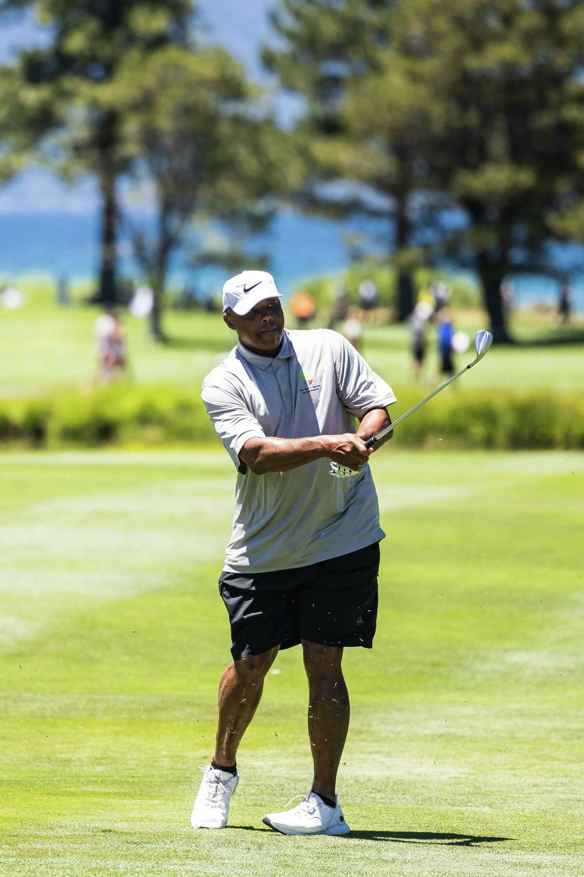 Charles Barkley hits his approach shot on No. 10 on Thursday at Edgewood Tahoe.