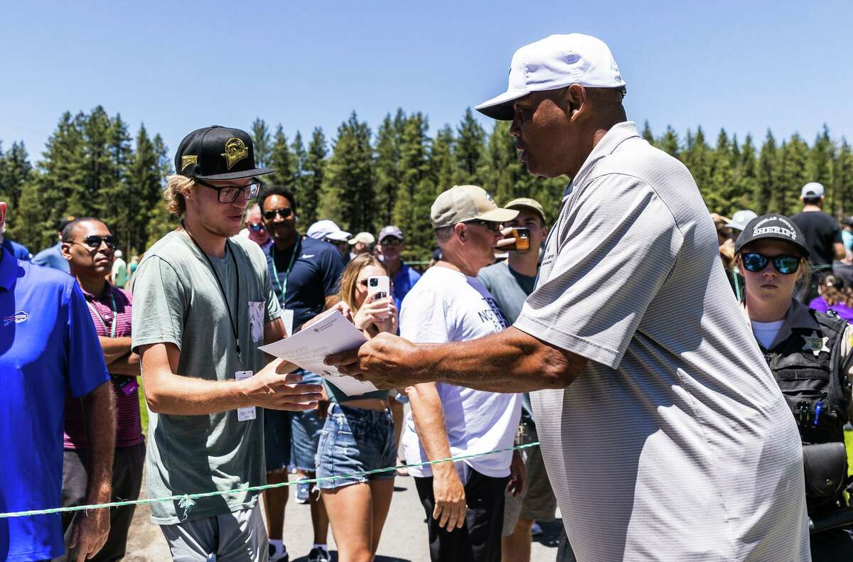 Charles Barkley signs autographs for fans during Thursday’s pro-am at the American Century Championship in Stateline, Nev.