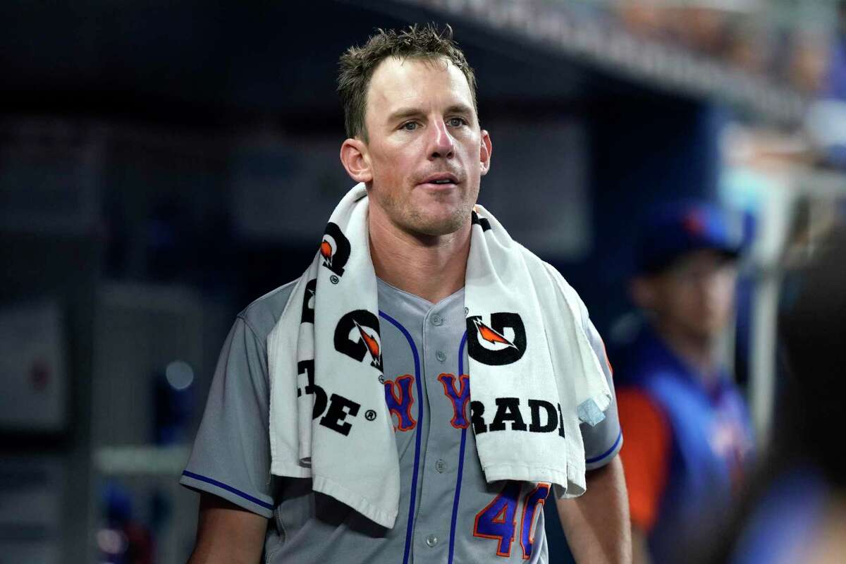 New York Mets starting pitcher Chris Bassitt stands in the dugout during a baseball game against the Miami Marlins, Saturday, June 25, 2022, in Miami. (AP Photo/Lynne Sladky)