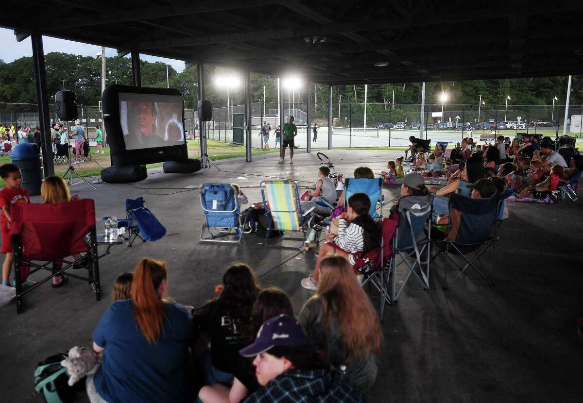 The movie Hook featuring Robin Williams kicks off the Downtown Milford Business Association's outdoor summer movie night series at the Fowler Field Pavilion in Milford, Conn. on Wednesday, July 6, 2022. Future dates for the series are July 13, 20, and 27.