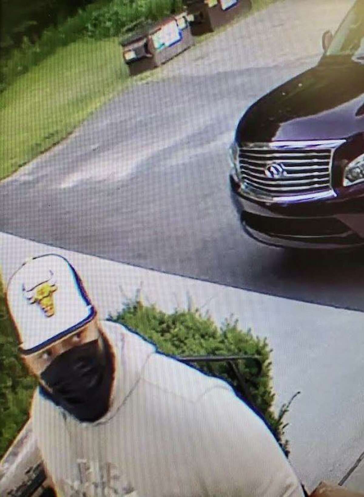New Milford police are trying to identify this man, who they say is a person of interest in a burglary investigation.