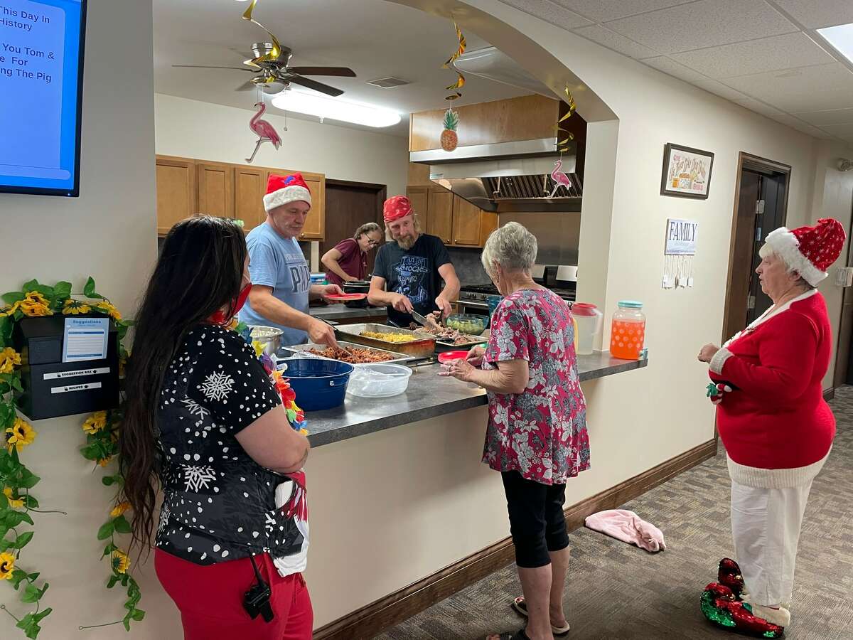 Christmas in July at The Fields Assisted living included a pig roast, live music, and even an appearance by Santa Claus.