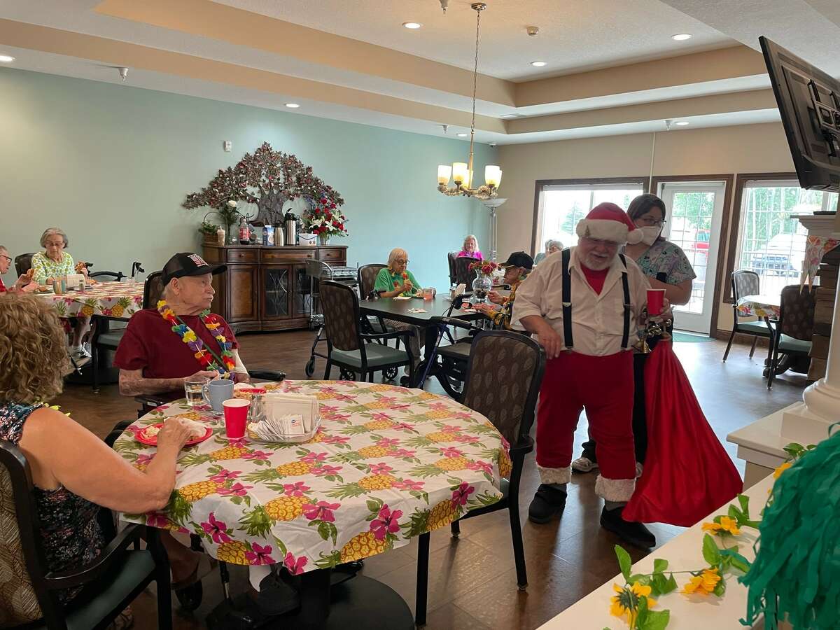 Christmas in July at The Fields Assisted living included a pig roast, live music, and even an appearance by Santa Claus.