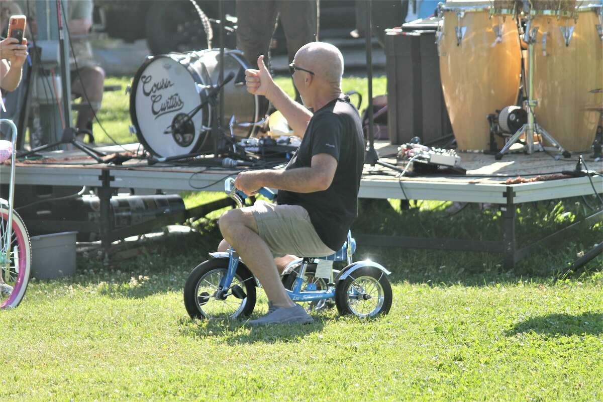 A bicycle raffle winner approves of his new ride Thursday during the Onekama Block Party.