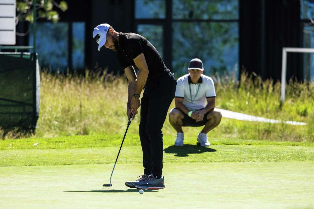 Warriors guard Stephen Curry putts for birdie on No. 9 during Thursday’s pro-am at Edgewood Tahoe. Curry says you can feel “amazing” after a good shot and “like trash” after a wayward one.