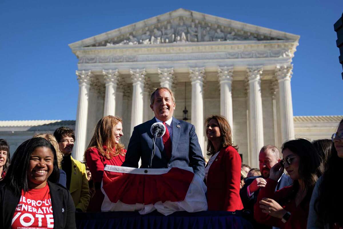 Texas Attorney General Ken Paxton speaks outside the U.S. Supreme Court on Nov. 1, 2021, in Washington, D.C., before the court heard arguments in a challenge to the controversial Texas abortion law, which bans abortions after six weeks.