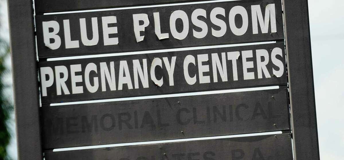 Sign for Blue Blossom Pregnancy Center on Thursday, July 7, 2022 in Houston. People seeking abortions in Houston may mistakenly arrive at one of 22 crisis pregnancy centers in the area. The centers give the appearance of an abortion clinic but attempt to dissuade patients from termination.