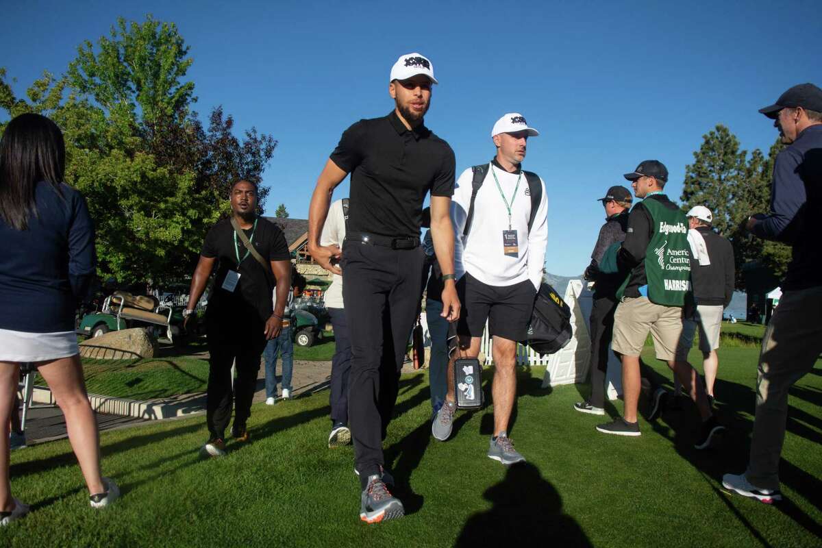 Golden State Warriors Stephen Curry arrives at the driving range before Thursday’s pro-am round. Curry holed out for eagle from 97 yards in Friday’s opening round.