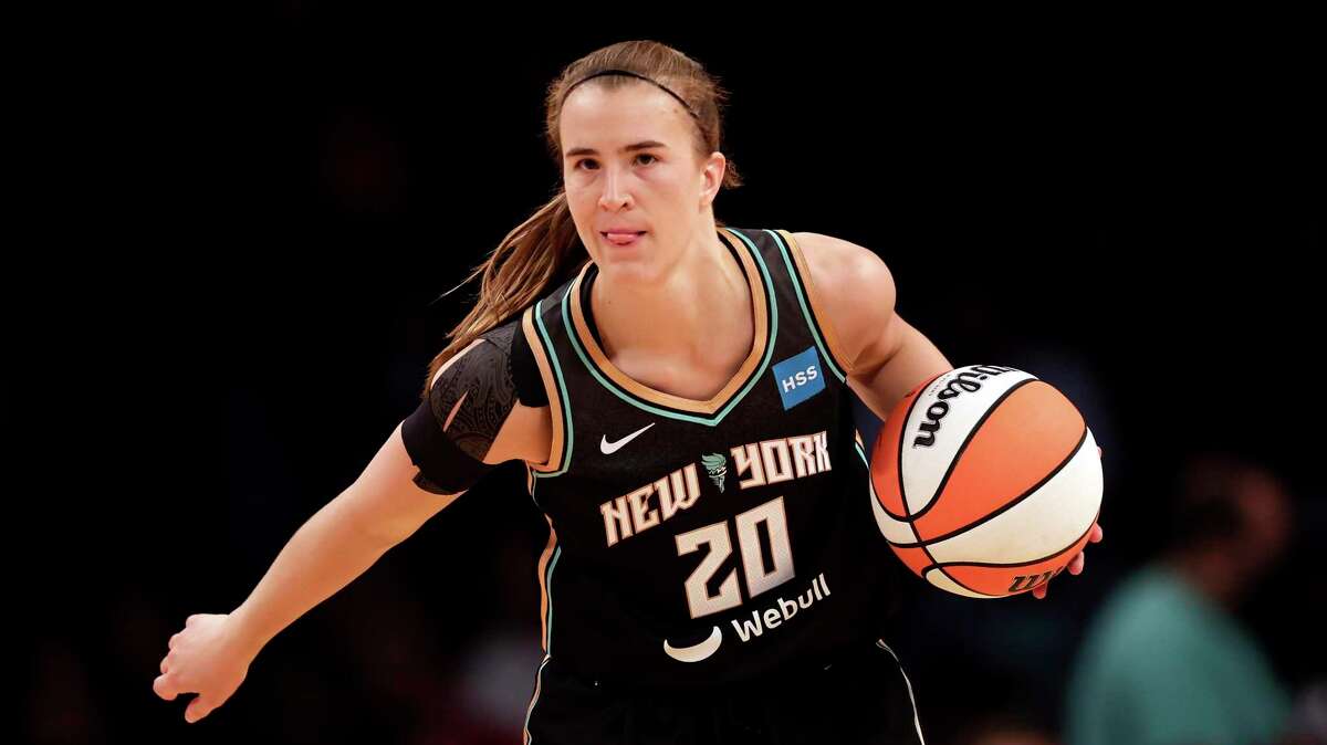 FILE - New York Liberty guard Sabrina Ionescu (20) looks to pass against the Connecticut Sun in the first half during a WNBA basketball game, Saturday, May 7, 2022, in New York. The New York Liberty are a work in progress. When coach Sandy Brondello took over the team this year she knew that it would take some time for the players to gel on the court. (AP Photo/Adam Hunger, File)