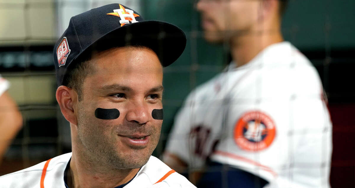 Houston Astros second baseman Jose Altuve (27) in the dugout before the AL Championship ring ceremony before the start of the Astros home opener MLB baseball game at Minute Maid Park on Monday, April 18, 2022 in Houston.