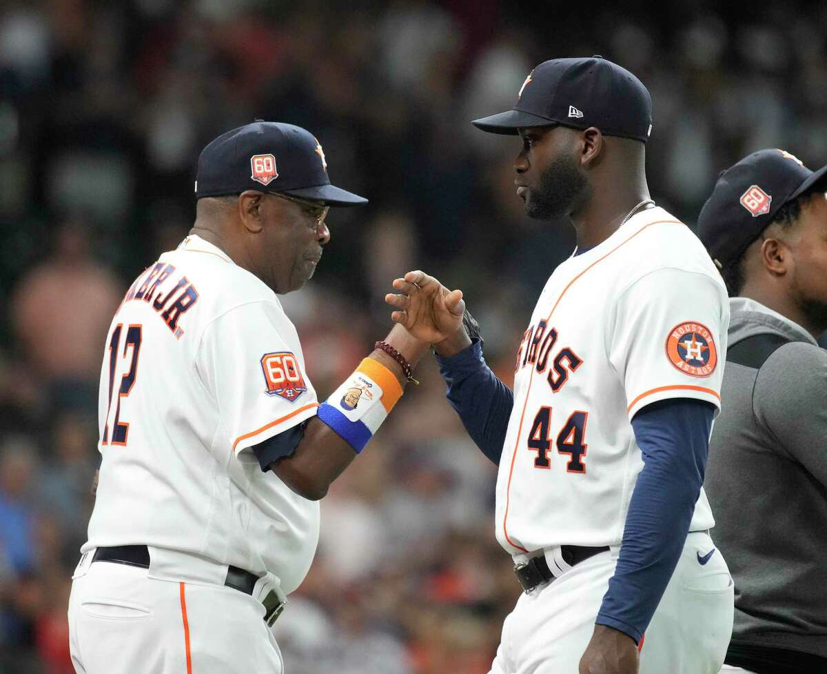 Houston Astros manager Dusty Baker Jr. (12) is congratulated by Yordan Alvarez (44) after the Astros beat the Kansas City Royals 5-2 after a MLB game at Minute Maid Park on Thursday, July 7, 2022 in Houston.