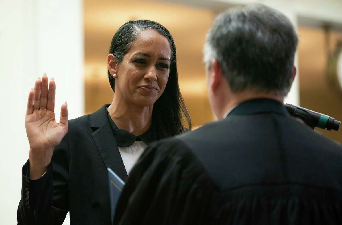Brooke Jenkins is sworn in as San Francisco district attorney by Judge Samuel Feng at City Hall on Friday. Jenkins succeeds the recalled Chesa Boudin.