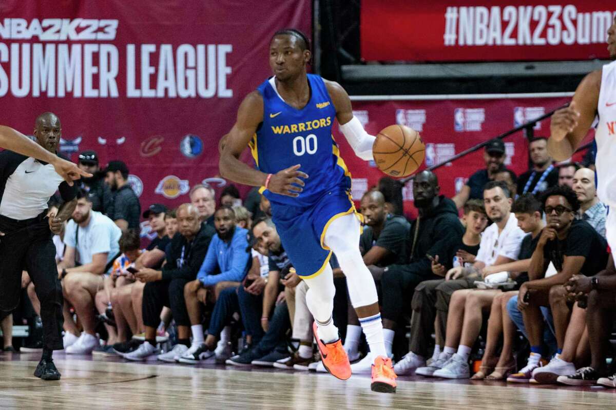 FILE - Golden State Warriors forward Jonathan Kuminga stands on the court  during the second half of an NBA basketball game against the Los Angeles  Clippers Monday, Feb. 14, 2022, in Los