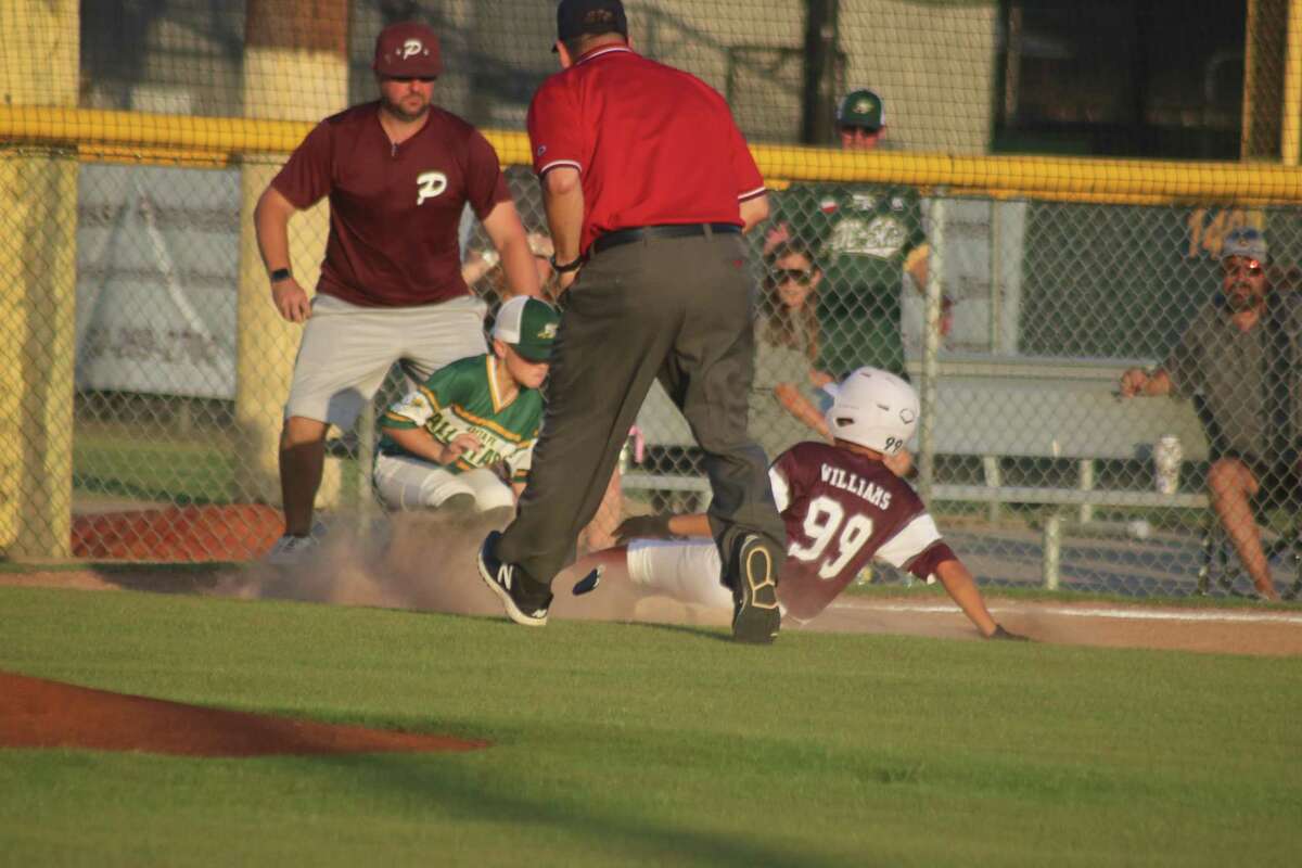 Pearland 11s all-star Dylan Williams gets tagged out at third base in the third inning Friday night. He had delivered an RBI double but some hesitancy as whether or not to go to third after a play at the plate led to this out.
