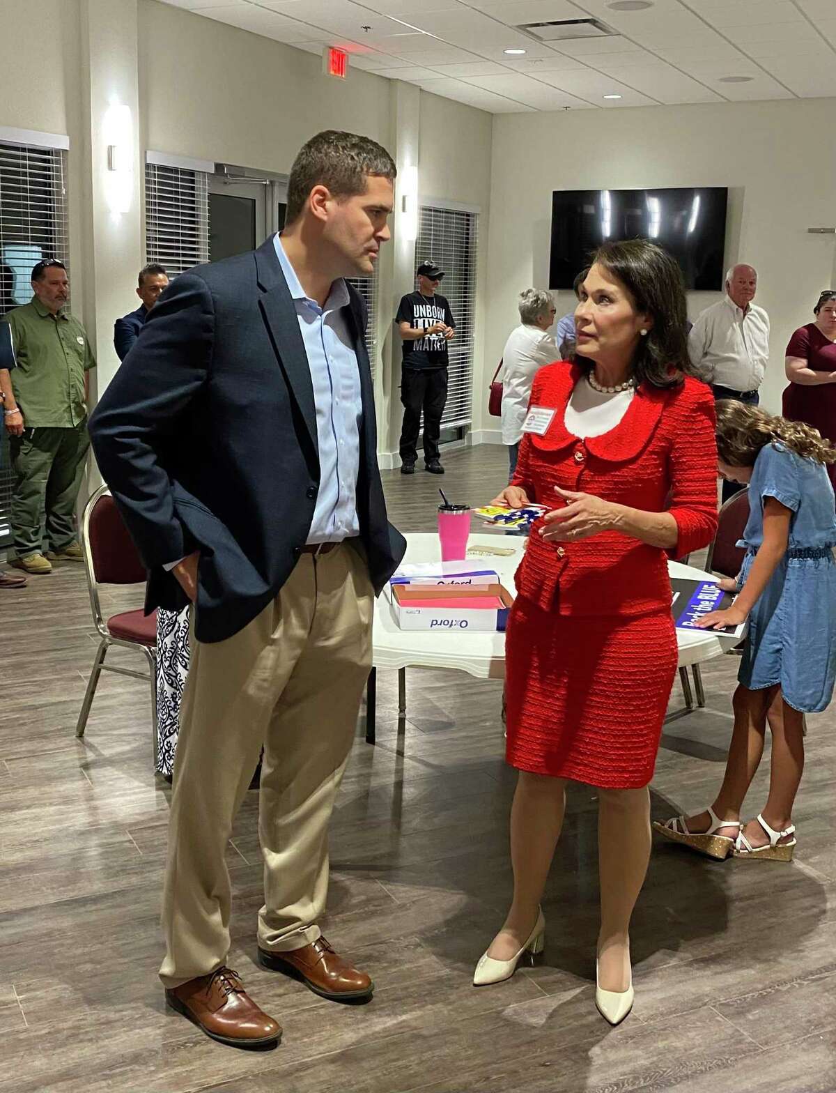 Grant Moody speaks with Marialyn Barnard just before the final results were announced at Thursday's GOP precinct-chair vote to select the party's nominee for Bexar County commissioner. Moody defeated Barnard for the nomination