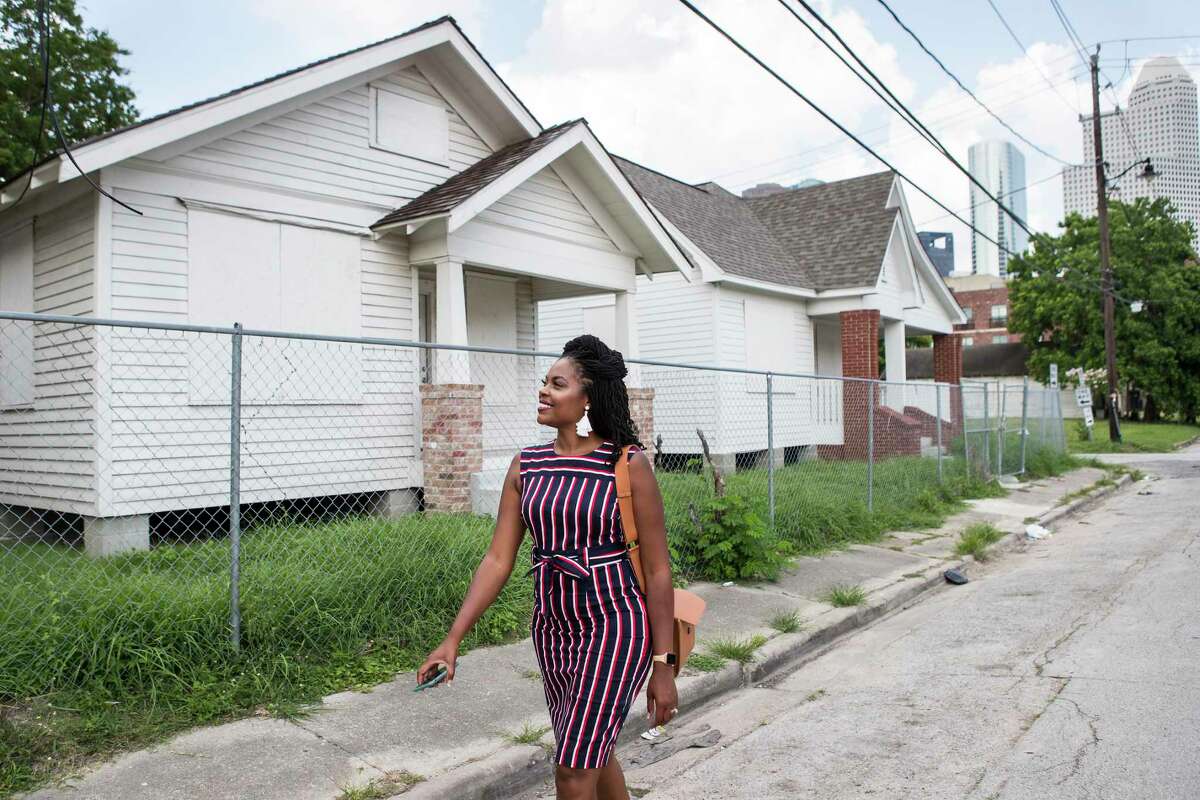 Zion Escobar, executive director of Houston Freedmen's Town Conservancy, walks past the future home of the Freedmen's Town Visitor Center Tuesday, June 15, 2021 in Houston. Houston City Council is voting Wednesday whether to designate Freedmen’s Town a Heritage District, permitting nonprofits to fund improvements in the district.