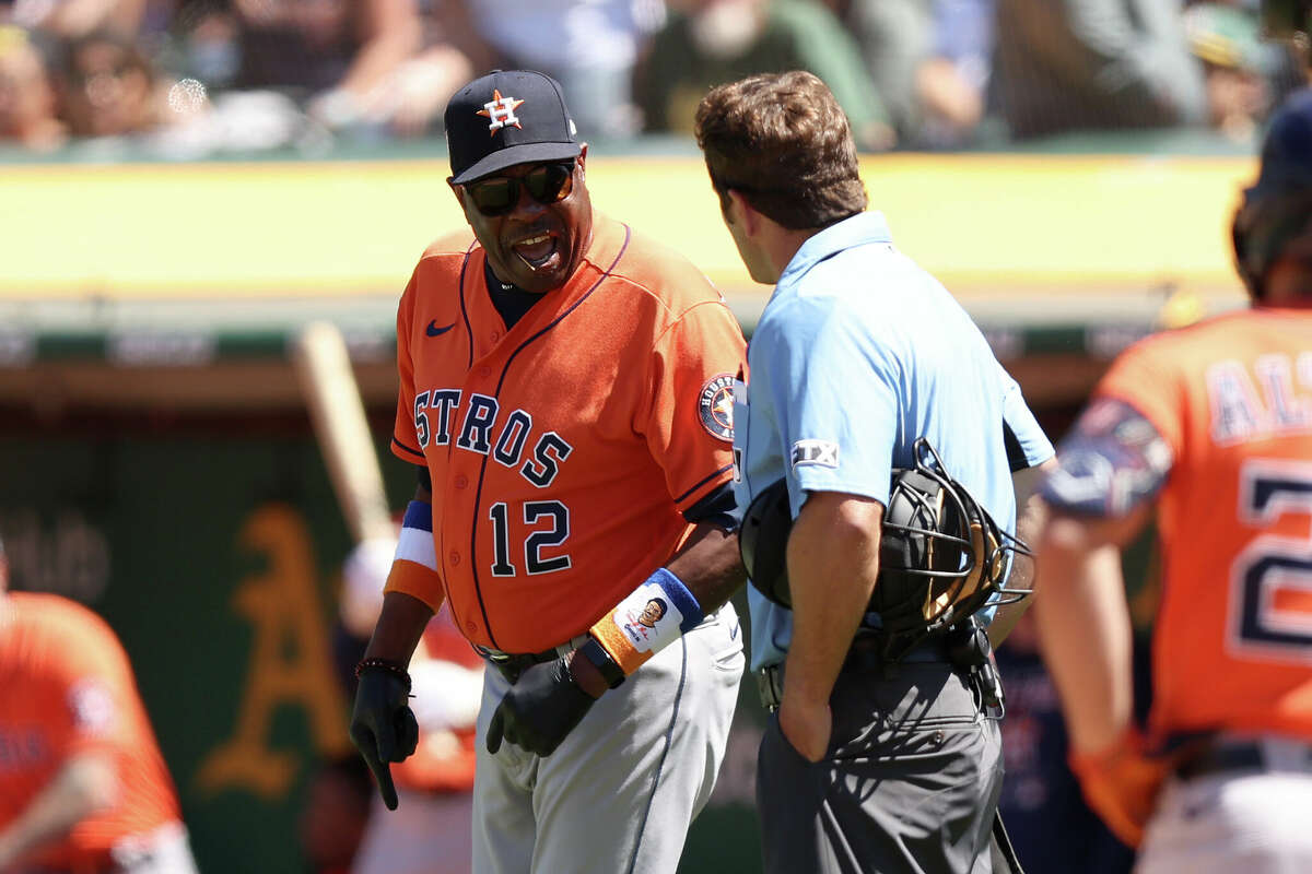OAKLAND, CALIFORNIA - JULY 09: Houston Astros manager Dusty Baker Jr. argues with home plate umpire Ben May #97 during the eighth inning of their game against the Oakland Athletics at RingCentral Coliseum on July 09, 2022 in Oakland, California. (Photo by Ezra Shaw/Getty Images)