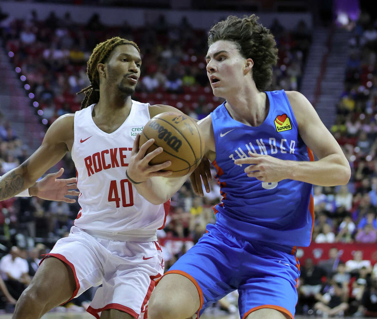 LAS VEGAS, NEVADA - JULY 09: Josh Giddey #3 of the Oklahoma City Thunder drives against Trhae Mitchell #40 of the Houston Rockets during the 2022 NBA Summer League at the Thomas & Mack Center on July 09, 2022 in Las Vegas, Nevada. NOTE TO USER: User expressly acknowledges and agrees that, by downloading and or using this photograph, User is consenting to the terms and conditions of the Getty Images License Agreement. (Photo by Ethan Miller/Getty Images)