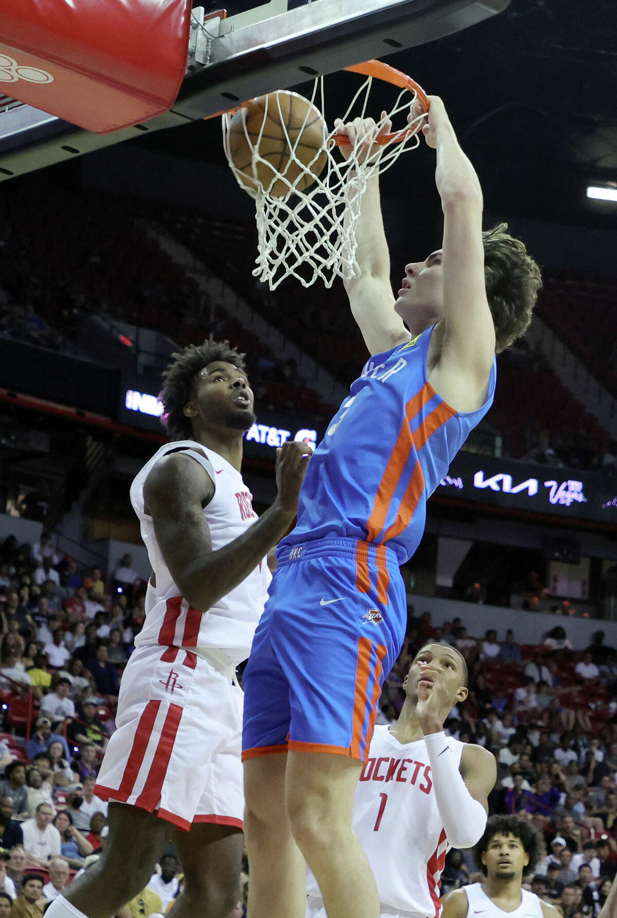LAS VEGAS, NEVADA - JULY 09: Josh Giddey #3 of the Oklahoma City Thunder dunks against Tari Eason #17 of the Houston Rockets during the 2022 NBA Summer League at the Thomas & Mack Center on July 09, 2022 in Las Vegas, Nevada. NOTE TO USER: User expressly acknowledges and agrees that, by downloading and or using this photograph, User is consenting to the terms and conditions of the Getty Images License Agreement. (Photo by Ethan Miller/Getty Images)