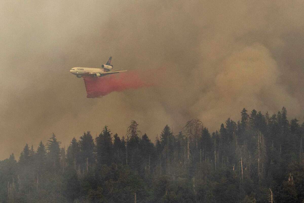 An air tanker makes a retardant drop while battling the Washburn Fire in Yosemite National Park, Calif. Saturday, July 9, 2022.
