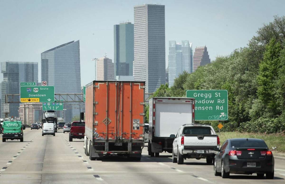 Drivers travel west on Interstate 10 towards downtown Houston on April 14, 2022. In the Houston area, state highway officials plan to spend $12.5 billion over the next decade.