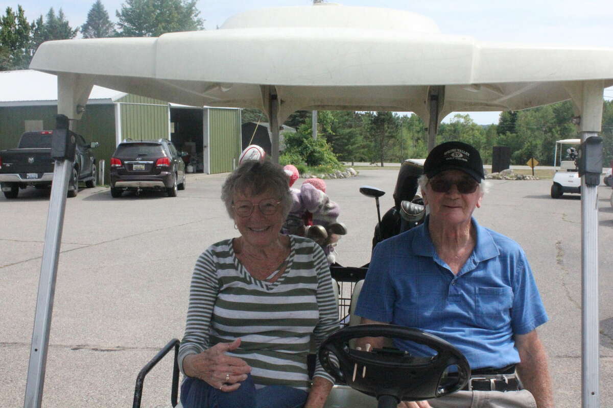 Don and Sharyn McGreehan get ready for a round of golf on Friday at Spring Valley Golf Course.