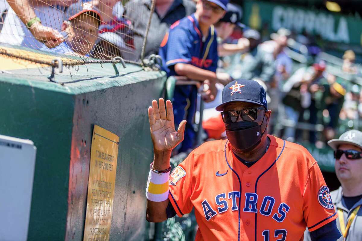 Houston Astros manager Dusty Baker Jr. waves to fans before a baseball game against the Oakland Athletics in Oakland, Calif., Sunday, July 10, 2022. (AP Photo/John Hefti)