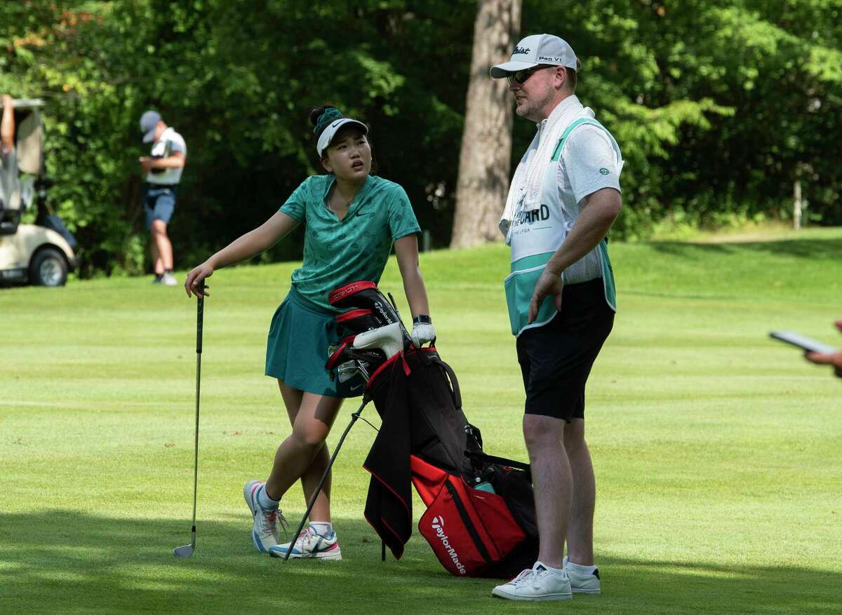 Lucy Li, left, talks with her caddie, Matthew McPhillips during the final round of the Twin Bridges Championship at Pniehaven Country Club on Sunday, July 10, 2022, in Guilderland, N.Y. (Paul Buckowski/Times Union)
