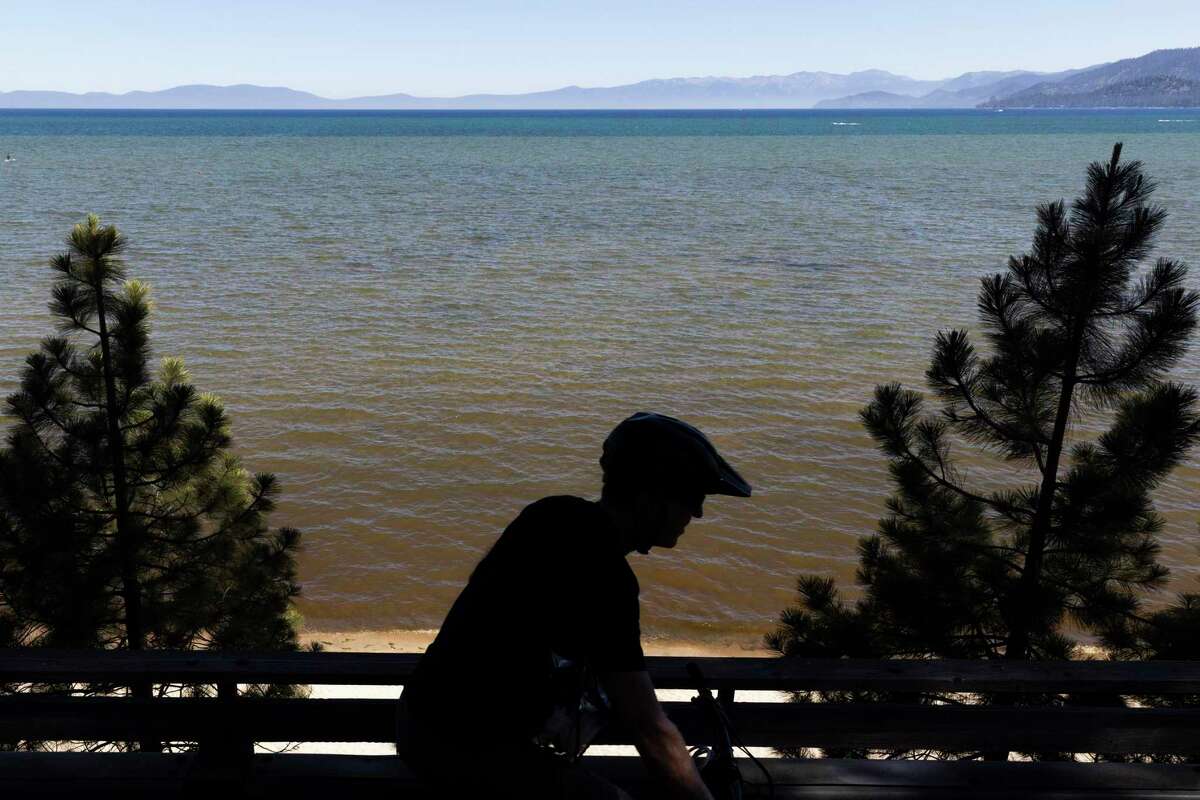 Water is cloudy off El Dorado Beach. Last year’s Caldor Fire, which burned into the basin near South Lake Tahoe, sent cascades of ashy runoff into the lake.