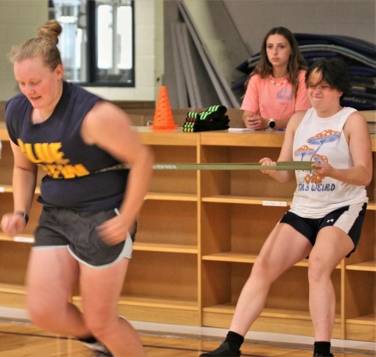Brethren's Elly Sexton (left) goes through a speed drill during a workout session on June 30 at Brethren High School.