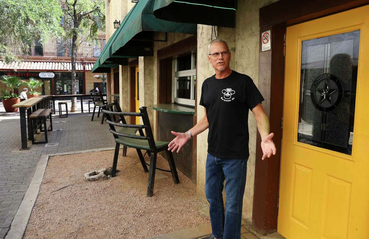 Moses Rose's Hideout bar owner Vince Cantu talks outside of his bar that is beside Maverick Walk on Thursday, July 7, 2022. One of the last business holdings in the footprint of the Alamo project, a bar ironically named after Louis “Moses” Rose, who is said to have fled the fort during the 1836 siege, has been given until July 11 to surrender its patio to the General Land Office for development of an Alamo museum and visitor center. Cantu's bar, Moses Rose’s Hideout, sits near the historic Woolworth Building on Houston street, and its patio is on city property, a right-of-way known as Maverick Walk, that is being leased to the GLO for the massive Alamo makeover. The bar’s sidewalk patio permit from the city expired more than two years ago. But Cantu says eliminating his outside patio area “may be the thing that puts me out of business” after surviving COVID, riots, cancelled conventions and high gas prices. He’s asking the Land Office to stand down until the end of the summer tourist season, noting that the amusement businesses fronting Alamo Plaza have until Oct. 31 to vacate.