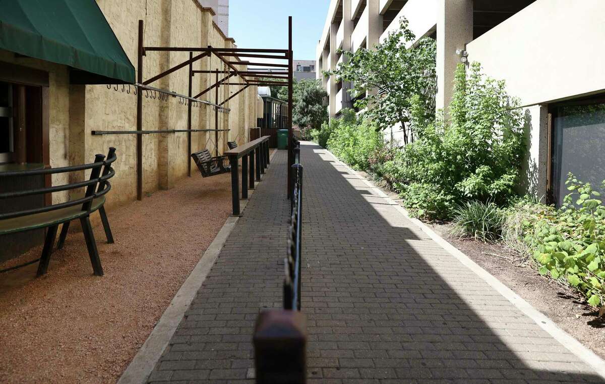 One of the last business holdings in the footprint of the Alamo project, a bar ironically named after Louis “Moses” Rose, who is said to have fled the fort during the 1836 siege, has been given until July 11 to surrender its patio (shown on left) to the General Land Office for development of an Alamo museum and visitor center. The bar, Moses Rose’s Hideout, sits near the historic Woolworth Building on Houston street, and its patio is on city property, a right-of-way known as Maverick Walk, that is being leased to the GLO for the massive Alamo makeover. The bar’s sidewalk patio permit from the city expired more than two years ago. But bar owner Vince Cantu says eliminating his outside patio area “may be the thing that puts me out of business” after surviving COVID, riots, cancelled conventions and high gas prices. He’s asking the Land Office to stand down until the end of the summer tourist season, noting that the amusement businesses fronting Alamo Plaza have until Oct. 31 to vacate.