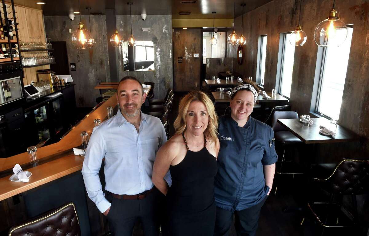 From left, Pearl Wine Bar co-owners Jimmy D'Addio and Emilie Penner and Lauren Hill, executive chef, are photographed in the newly opened Pearl Wine Bar on Main Street in Branford on July 8, 2022.