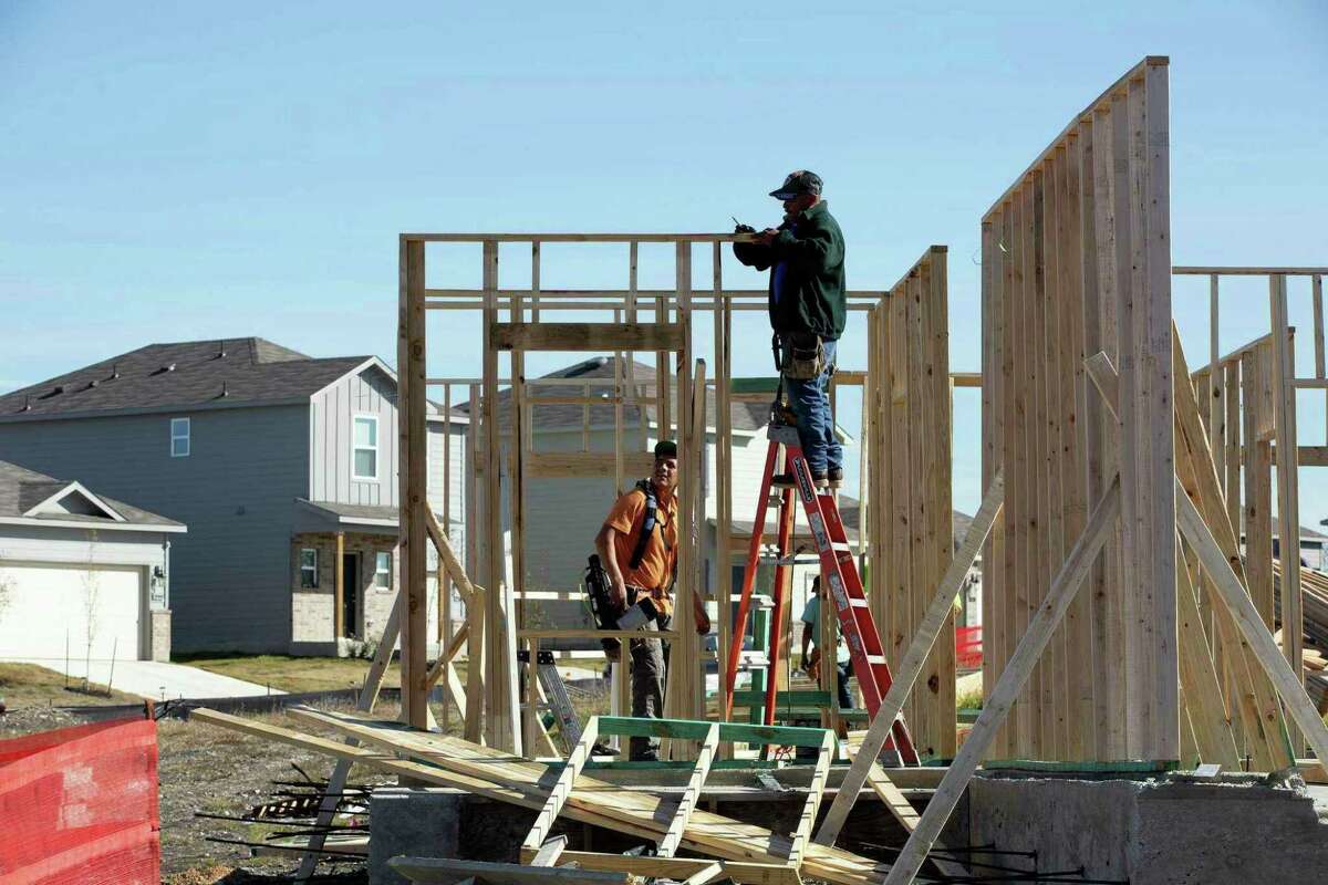 Crews work on homes under construction in Converse in January.